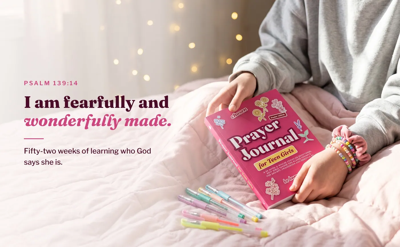 A teen girl holding Prayer Journal for Teen Girls on a pink blanket, with Psalm 139:14, I am fearfully and wonderfully made